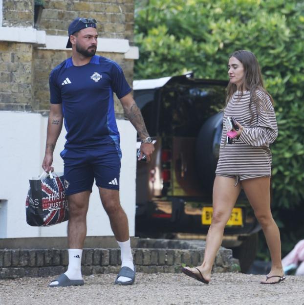 Emily Andrea and Carl Woods walking together.