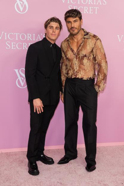Lukas Gage and Chris Appleton posing at the Victoria's Secret event.