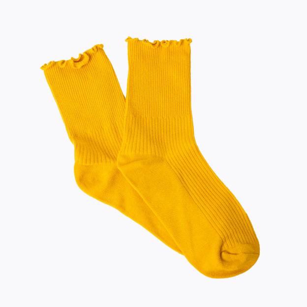 Pair of bright yellow ruffled edge socks.