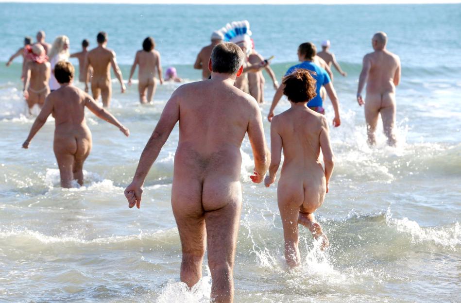Nudists and naturists take a last swim of the year, Cap d'Agde, France - 31 Dec 2014