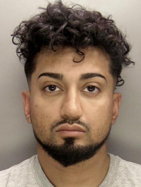 Mugshot of Imran Uddin, a man with dark curly hair and a dark goatee, staring directly into the camera.