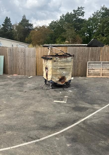 Burned waste bin at Four Houses Corner traveller site in Ufton Nervet, Berkshire.