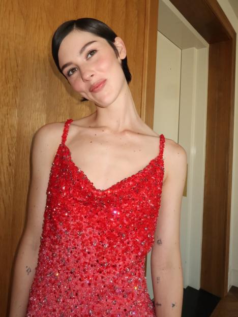 Gracie Abrams in a red glitter dress.