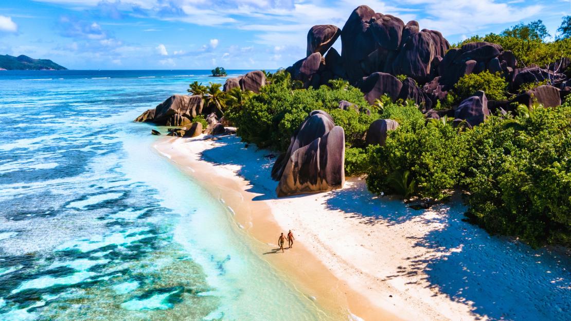 Stunning sunset walk on Anse Source dArgent beach in La Digue Seychelles
