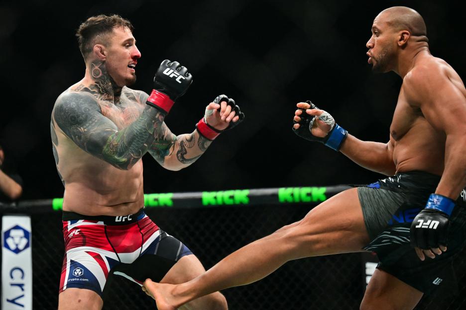 France's Ciryl Gane kicks Britain's Tom Aspinall during their UFC heavyweight title bout.