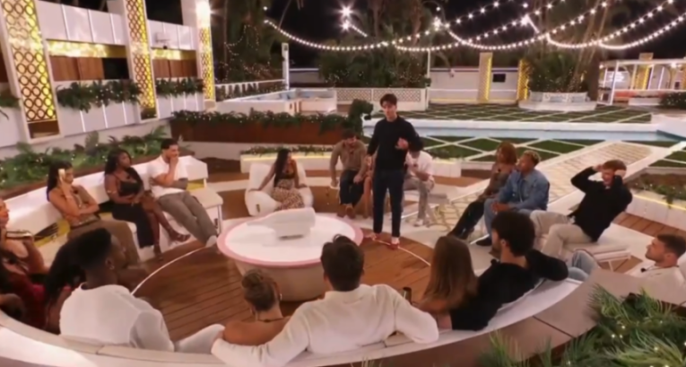 Tommy from Love Island in a heated discussion with fellow contestants.