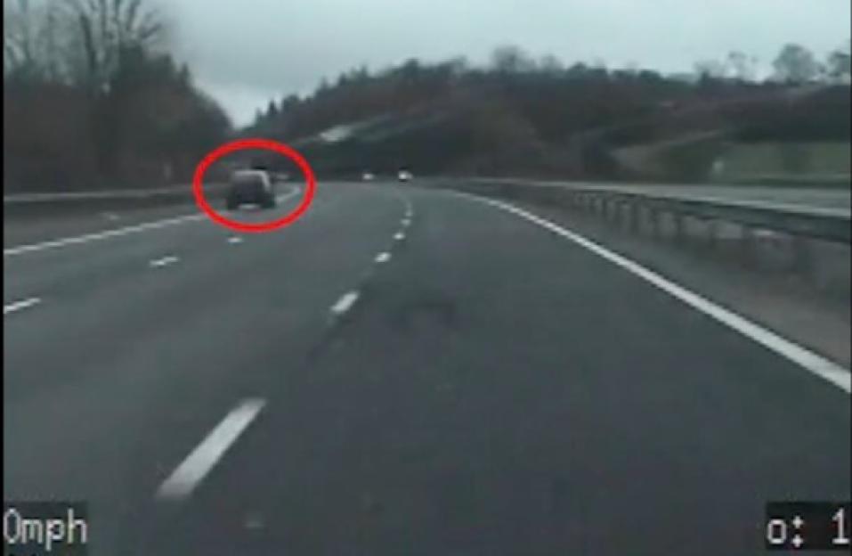Dashcam footage of a car being pursued on the M20 highway.