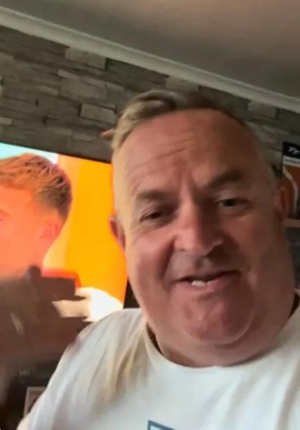 Elicia's father reacting to Finley and Ellie on television.