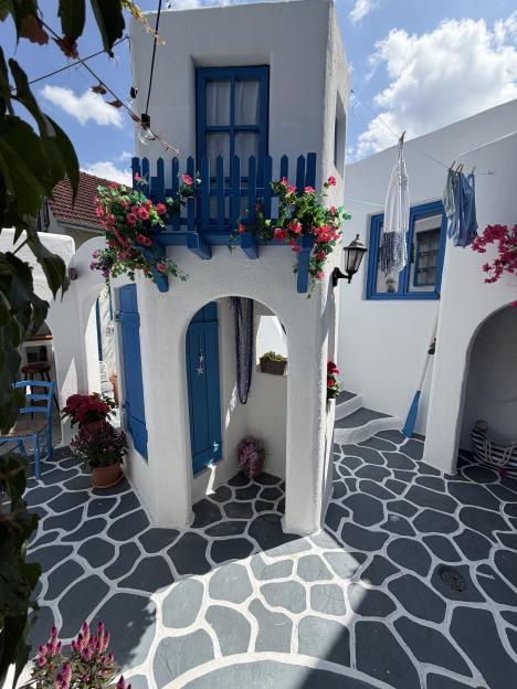 We made a mini Greek village in our garden - fitted with a bar