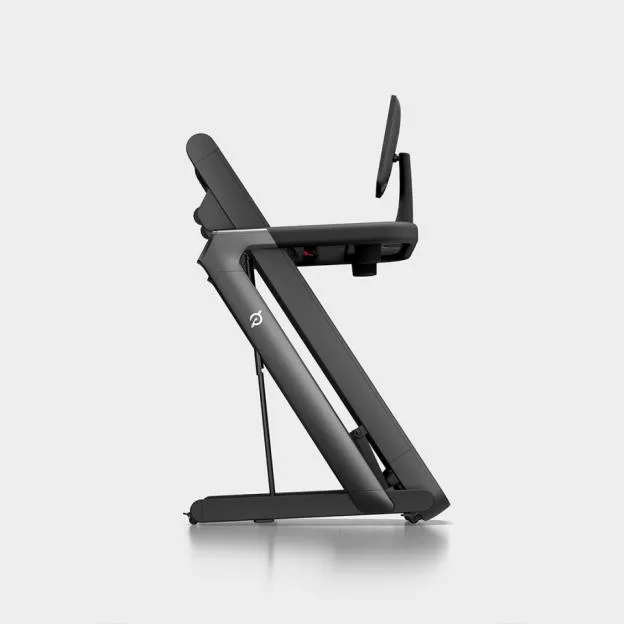 Foldable Peloton Tread Flex treadmill in a folded position.