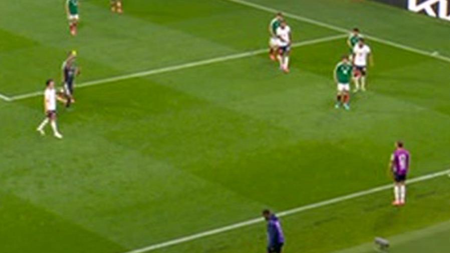 Soccer players on a green field.
