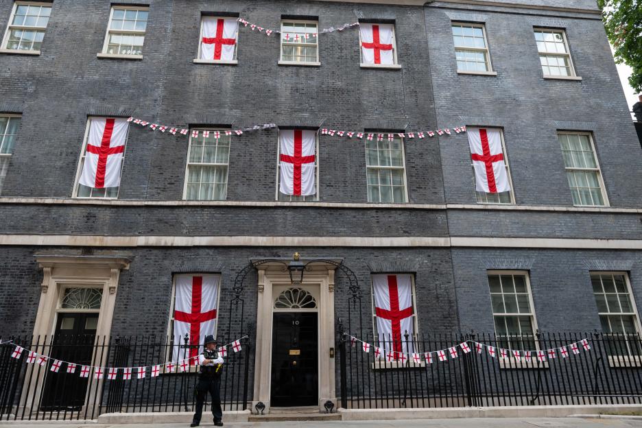 England flags hang from the windows of 10 Downing Street.