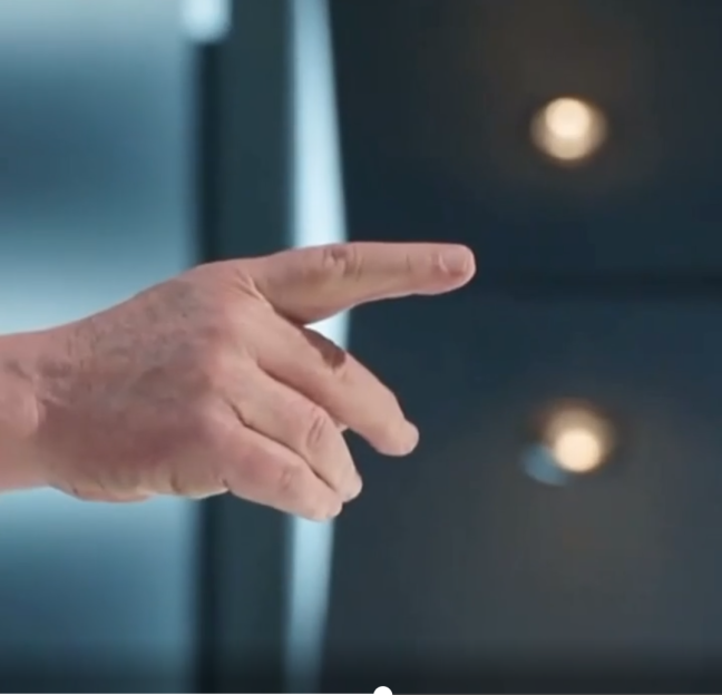 An outstretched hand with index finger pointing forward.
