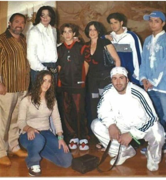 Michael Jackson standing with the Cascio family.
