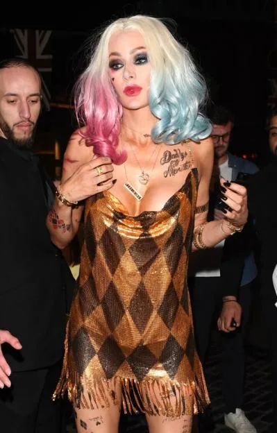 Olivia Attwood almost falls out of plunging minidress dressed as Harley Quinn for celeb-packed Halloween party