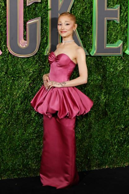 Ariana Grande in a pink strapless Louis Vuitton dress with a peplum at the "Wicked" premiere.