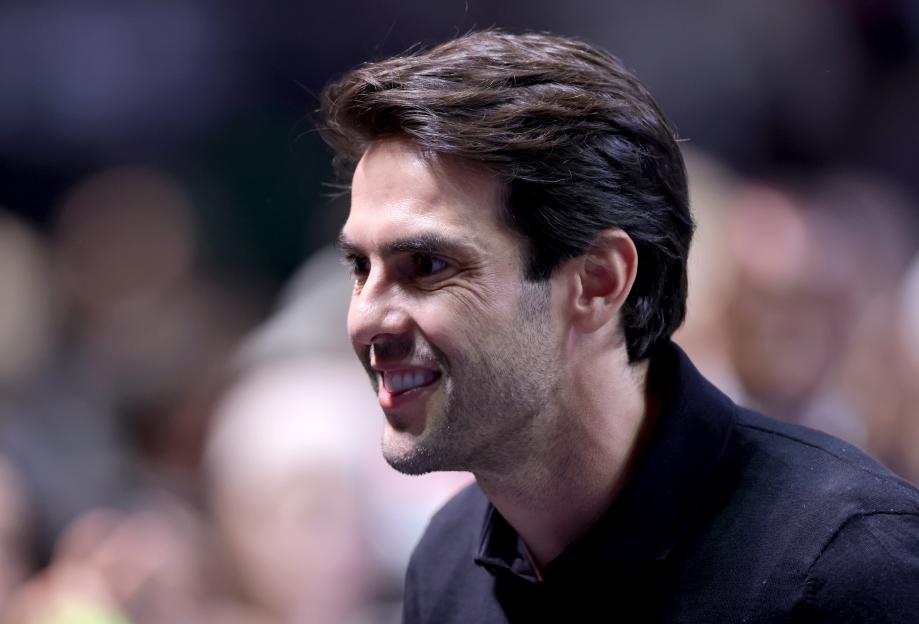 Former footballer Kaka smiles, looking to the left.