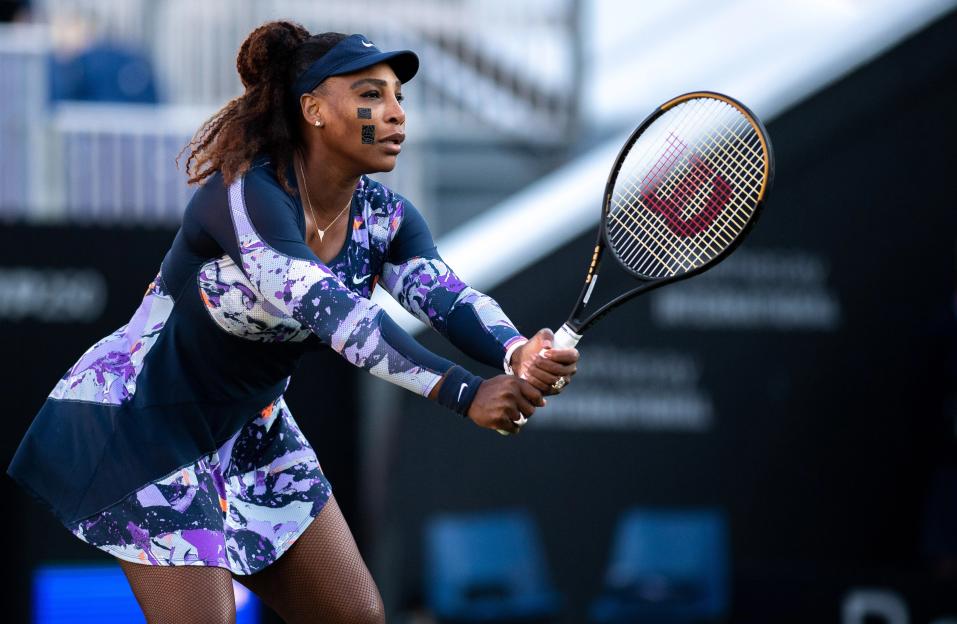 Serena Williams playing tennis during a doubles quarter-final match.