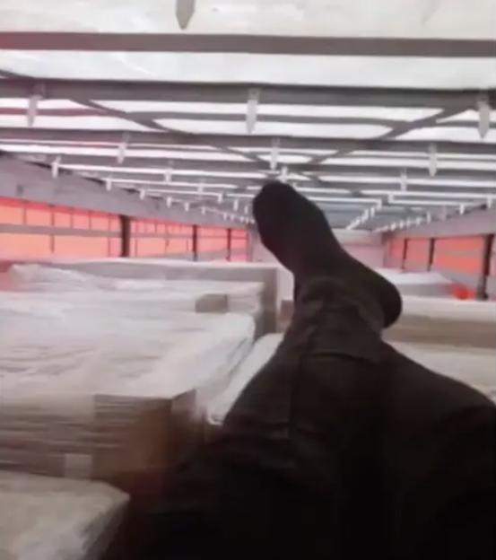 A migrant's legs inside a lorry.