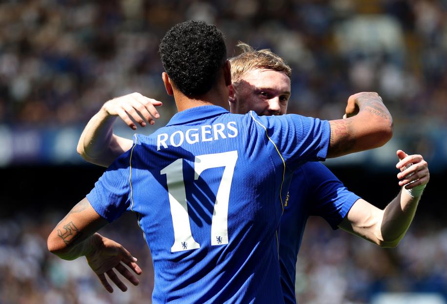 Morgan Rogers (number 17) embraces Cole Palmer after scoring for Chelsea.
