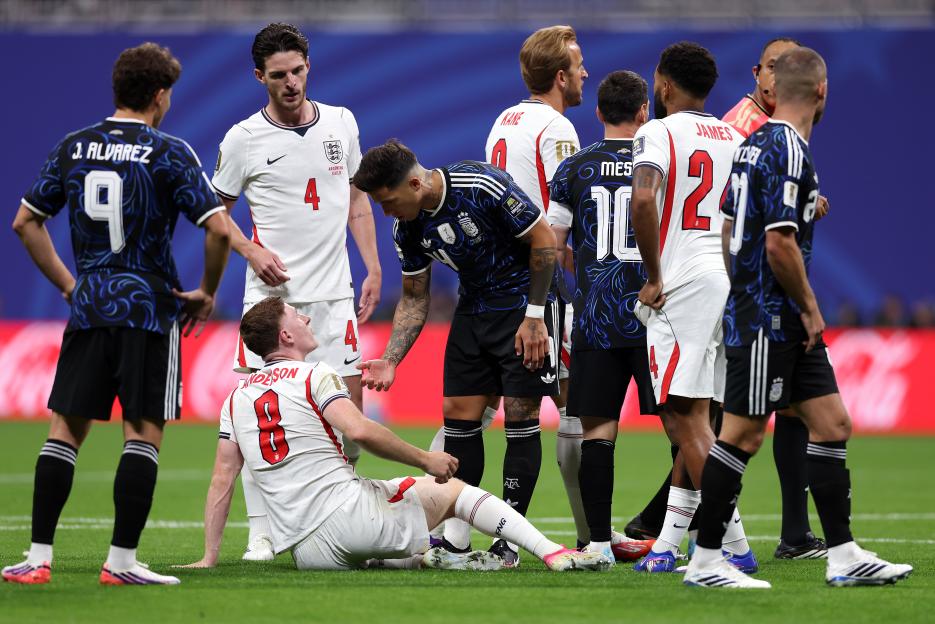 England's Elliot Anderson on the ground after a challenge from Argentina's Enzo Fernandez during a FIFA World Cup 2026 semi-final match.