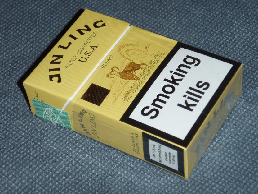 A pack of Jin Ling cigarettes with a "Smoking Kills" warning label.