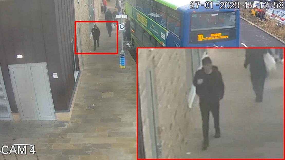CCTV image of Logan MacPhail walking down a street after getting off a bus.