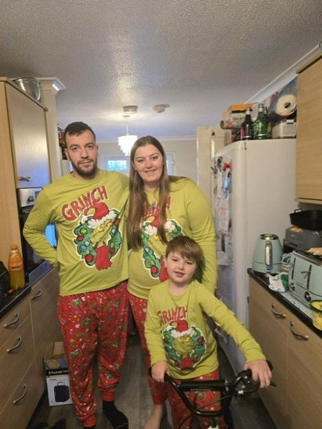 Adam, Tegan, and Tyler in matching Grinch pajamas.