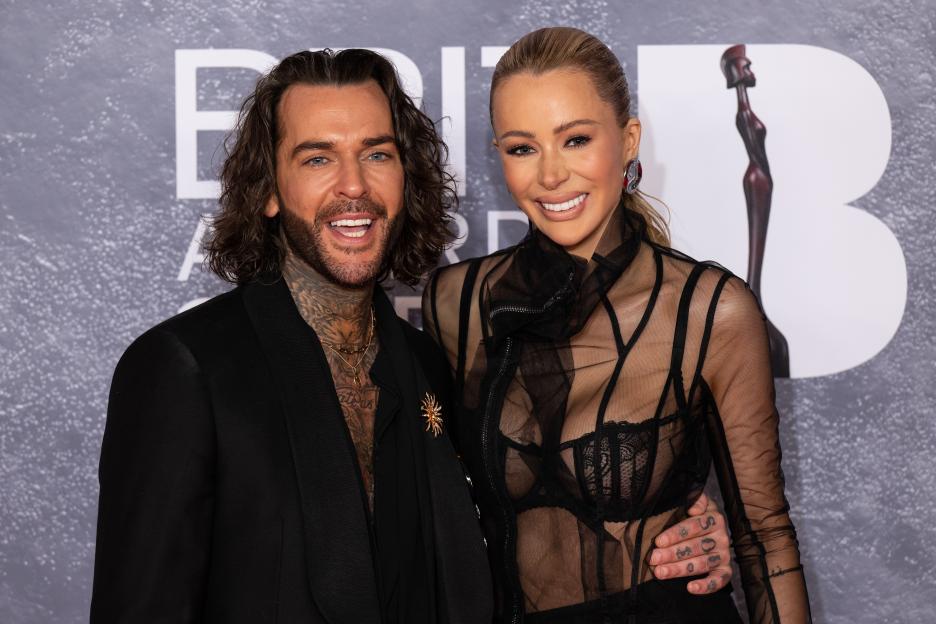 Pete Wicks and Olivia Attwood posing together at The BRIT Awards 2025.