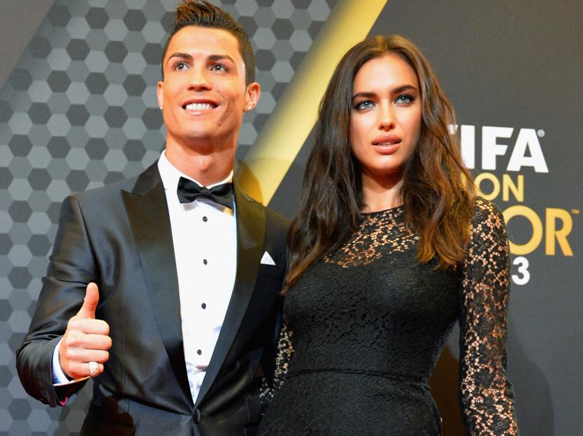 Cristiano Ronaldo gives a thumbs-up as he poses with Irina Shayk at the FIFA Ballon d'Or Gala 2013.
