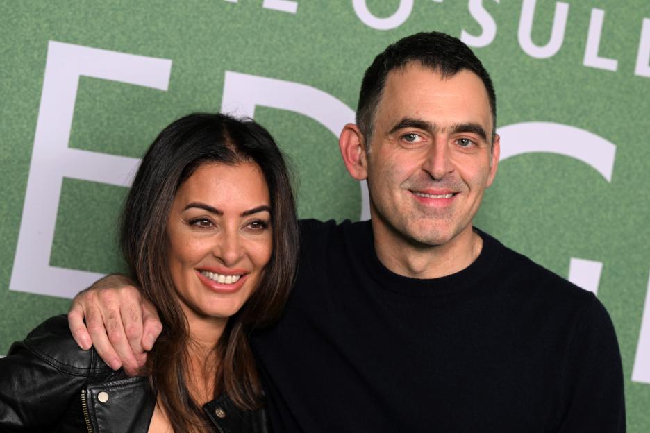 Laila Rouass and Ronnie O'Sullivan smiling at the premiere event.