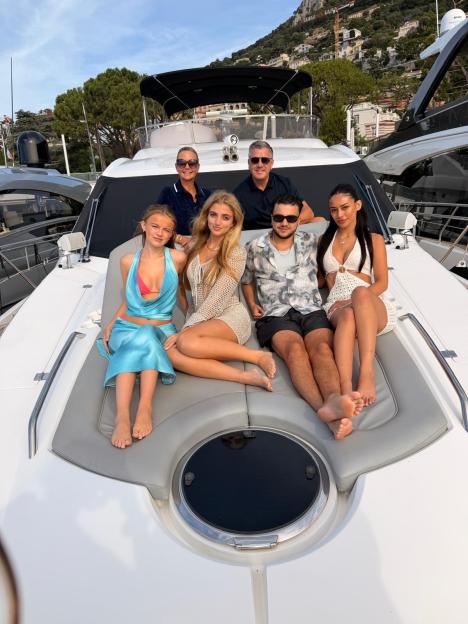 Princess Andre and family posing on a yacht in Monaco.