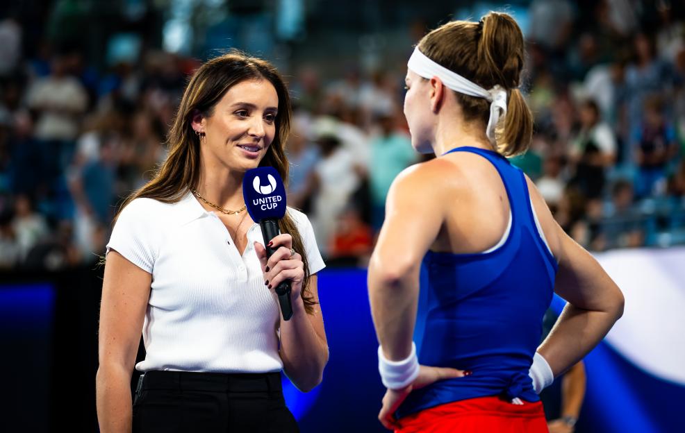 Laura Robson interviews Karolina Muchova on a tennis court.