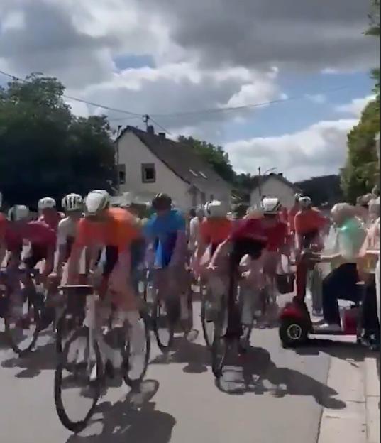 'Shocking Collision: Granny on Mobility Scooter Sparks Major Cycling Crash in Race by Rolling into Speeding Peloton'