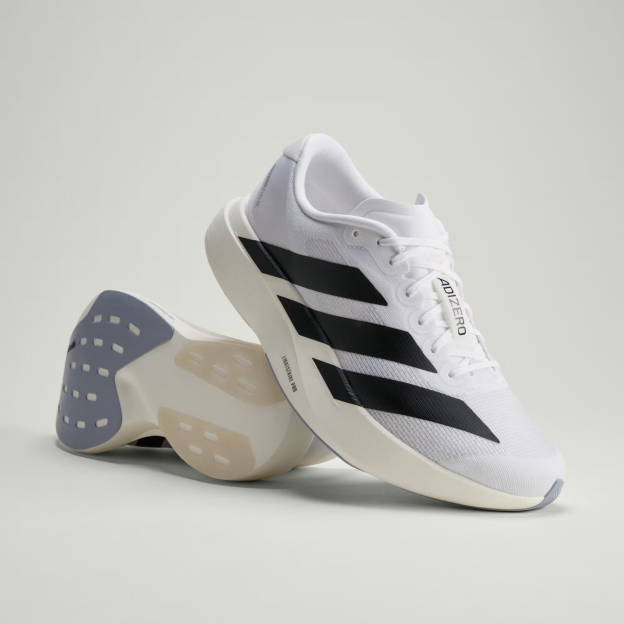 A pair of white Adidas Adizero running shoes with black stripes, one standing upright and the other lying on its side.