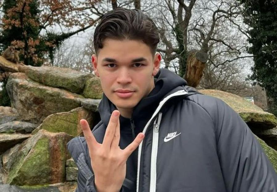 Jack Joseph, a TikTok comedian, wearing a black puffer jacket and holding up three fingers.