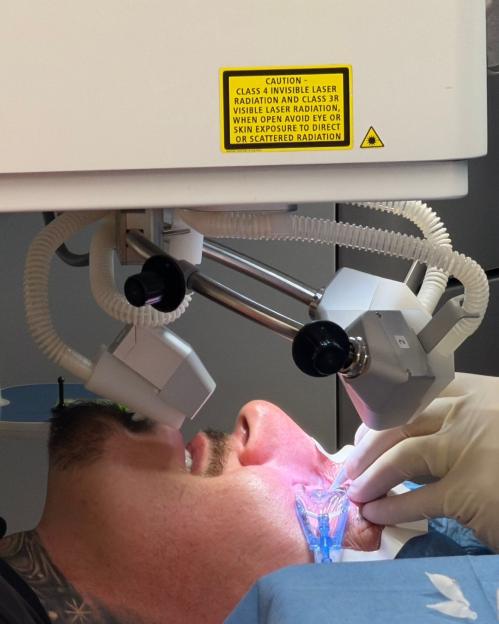 Tom Aspinall undergoing eye surgery with a laser.