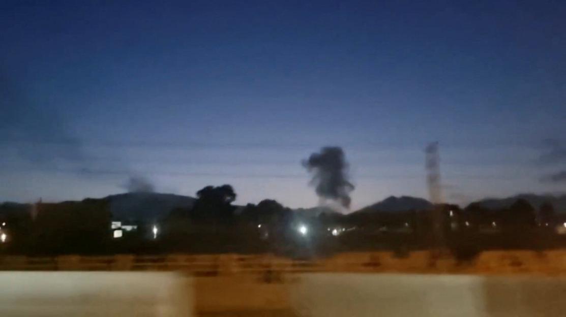 A plume of smoke rises, as Iranian news agencies reported explosions were heard in several cities across the country, in Karaj