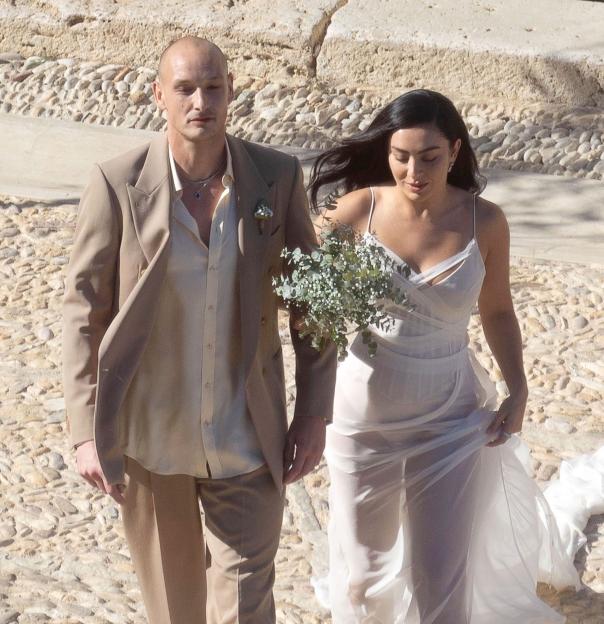 *PREMIUM-EXCLUSIVE* MUST CALL FOR PRICING BEFORE USAGE - English The pop star Charli XCX and her husband, The 1975 drummer George Daniel, looked every bit the picture of love as they hosted a second wedding celebration in Italy, just two months after