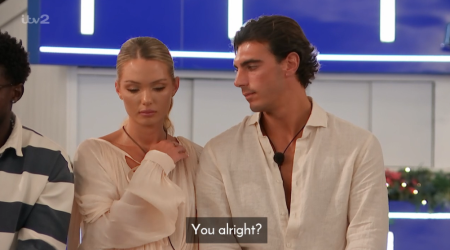 A man looks at a woman with concern, while the woman looks down sadly, with the caption "You alright?"