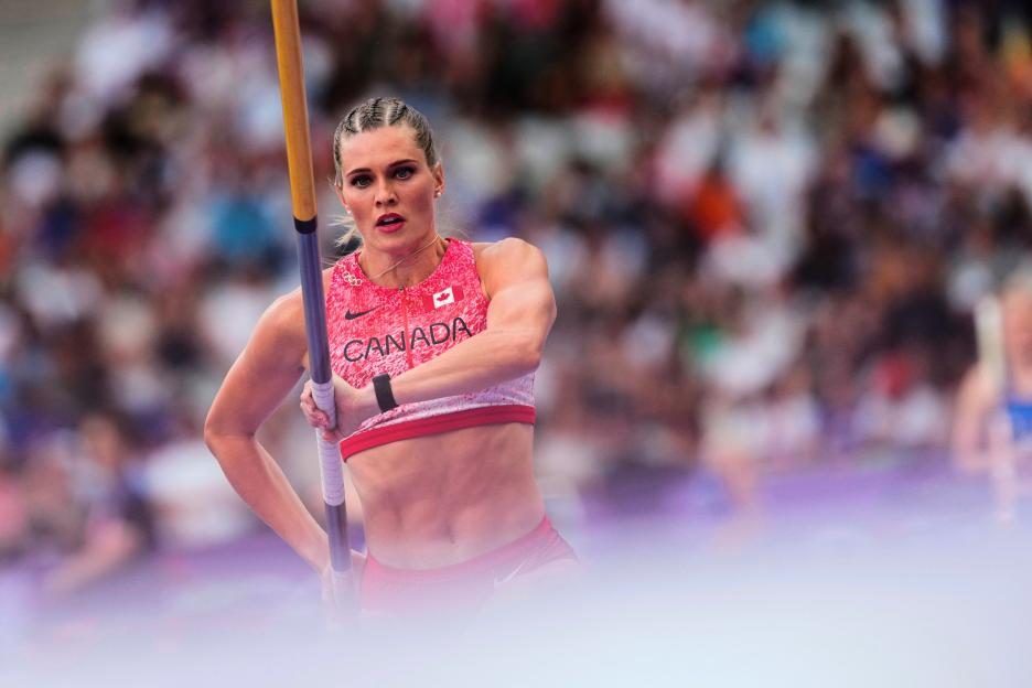 Alysha Newman, a Canadian pole vaulter, is shown preparing for a jump.