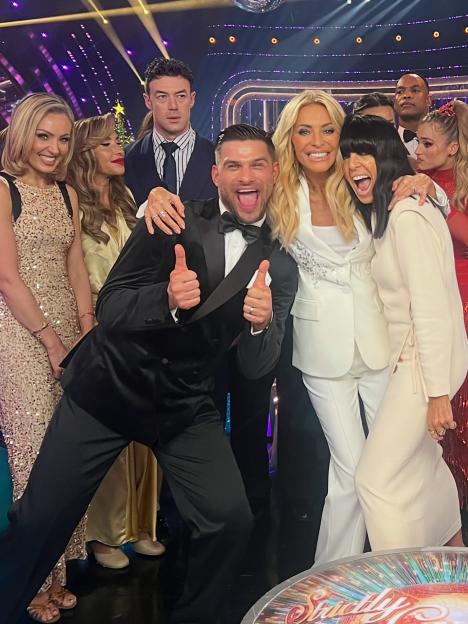 Cast of Strictly Come Dancing with Tess Daly, Amy Dowden, Mel Blatt, Kai Widdrington, Aljaz Skorjanec, and Claudia Winkleman.
