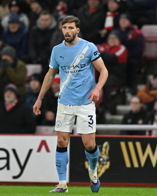 Ruben Dias in his Manchester City kit during a match.