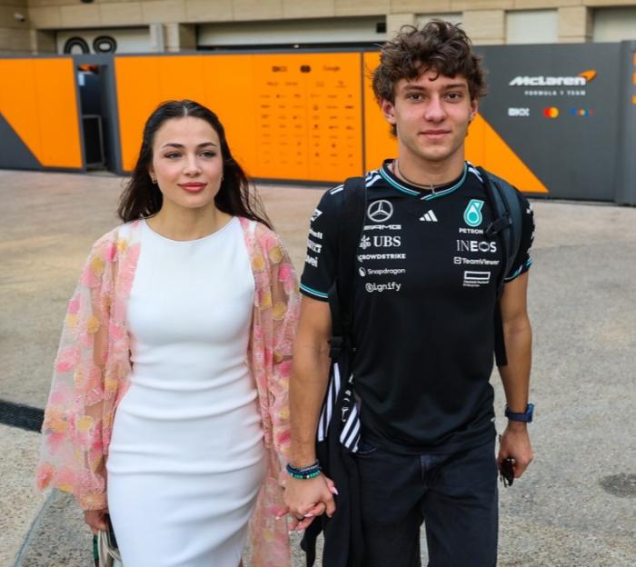 Antonella Bassani and Andrea Kimi Antonelli holding hands at the F1 Grand Prix of Qatar.