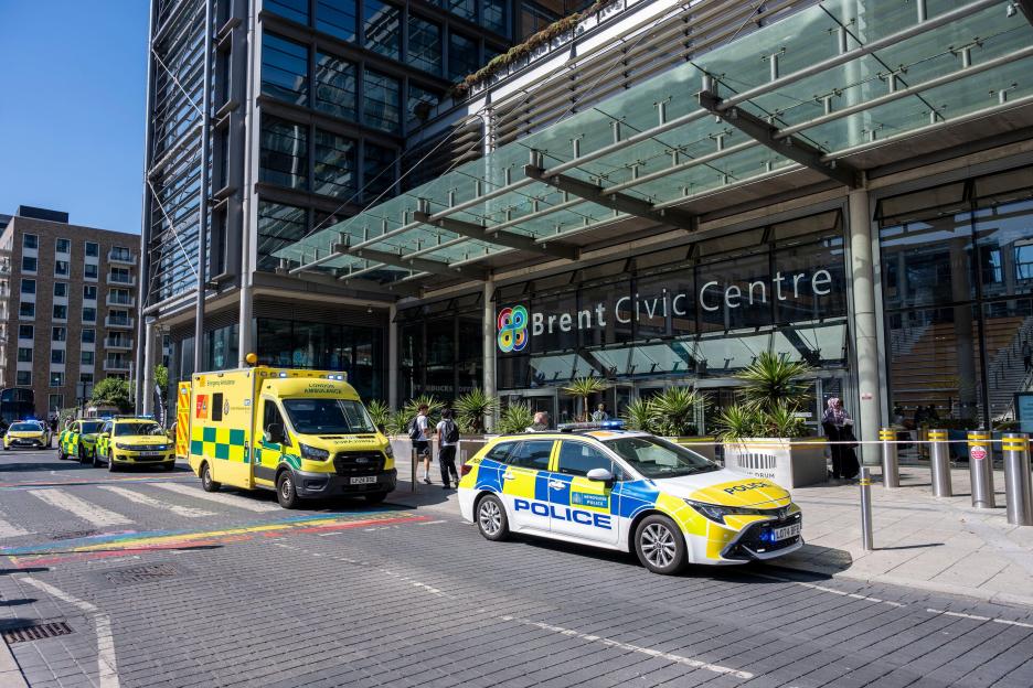 Emergency services, including police cars and ambulances, are outside the Brent Civic Centre, which has been cordoned off.
