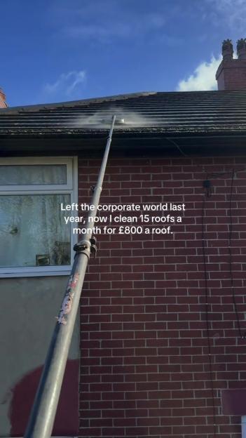A long-handled pressure washer cleaning a tiled roof, with text overlay.