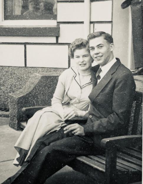 June and Peter Buffham circa 1958, seated on a bench.