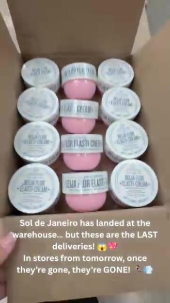 A box filled with jars of Sol de Janeiro cream, some pink and some white.