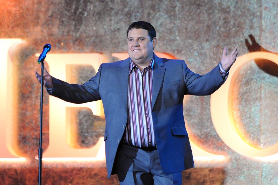 Comedian Peter Kay performing live on stage.
