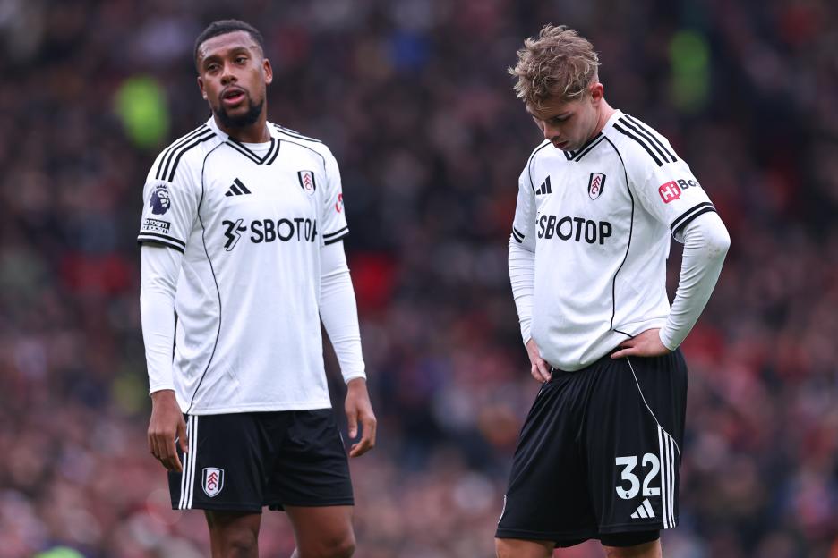 Dejected Fulham players Emile Smith Rowe and Alex Iwobi.